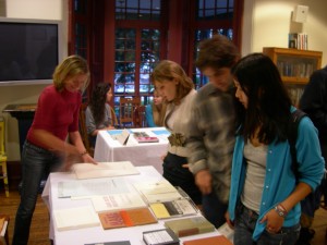 Megan O’Connell (l.) talks with KWH curator Kaegan Sparks at the 'Poems/Posters' fair