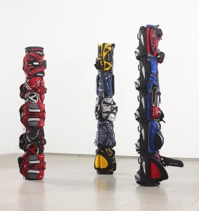 Brian Jungen ‘1980,’ ‘1970,’ and ‘1960' (2007), golf bags with golf balls and painted golf tees, 139, 151 and 156 in. high, Art Gallery of Ontario