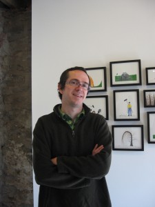 Colin Keefe in front of work by John Slaby at Mt. Airy Contemporary