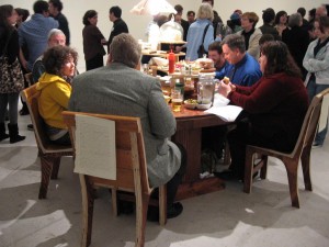 Susanna Gieske, You Can't Help Yourself. The family here is eating in the middle of the exhibition.