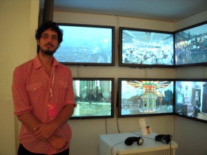 Nick Marzano of The Glue Society standing by his piece about the solar eclipse at Pulse