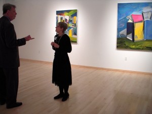 Tyler Print Department professor Hester Stinnett with Fabian Lopez's paintings.
