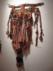 Martina Johnson-Allen, Haint's Apron Replete with Chemotherapy Dreds II, mixed media acrylic painted papers, beads, feathers, wire, shells, fiber, twine, buttons, animal bones, selected objects, 36 x 24 inches, 2009 