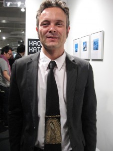 T 20 gallerist Nacho Ruiz wearing his Lady of Guadalupe tie. Religious bling bling.