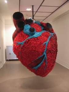 Pepon Osorio, My Beating Heart, mixed mediums, 2000, speakers with sound, archival paper, acrylic, fiber glass, 72 x 65 inches in diameter