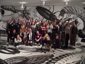 The Philagrafika artist and curators pose amidst Regina Silveiro's bug invasion at Moore College.