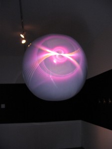 Sean Stoops, Interstellar Medium j2010 digital vidio installation, 4:56 mins, with, behind, the aureola around the shadow cast by the hanging globe