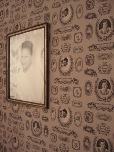 Katie Tachman's wallpaper installation merges portraits of her own family, Zettie Brown's, and those of complete strangers from found photos.