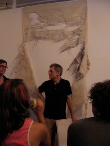 Arcadia curator Richard Torchia preparing to speak at Vox Populi last week. Andrew Suggs, Vox Populi executive director, is on the left.