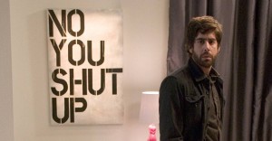 Adam Goldberg, who plays a composer of pretentious noise music, standing in front of a Christopher Wool parody in the movie (untitled).