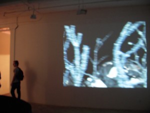 Brent Wahl's revolving piece projected on the wall.