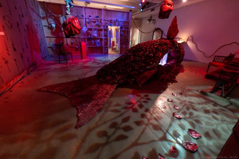 In the largest room of the exhibition, visitors encounter multiple videosculptures, including a large red snapper.