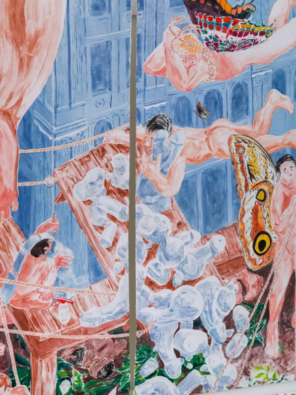 A detail of a 27-panel art work shows a tilted wood table spilling its contents, what look like pale blue sculptures of penises, which tumble downward. Several nude workers try to right the table.