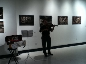 A violinist led visitors though along through the gallery space on First Friday December 7th
